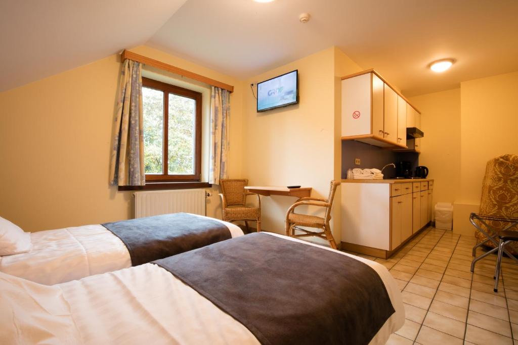 Postel nebo postele na pokoji v ubytování Hotel Beau Site