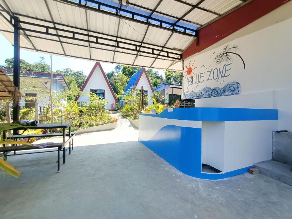 a room with a blue and white table in the middle at Vital Point Kampot in Kampot