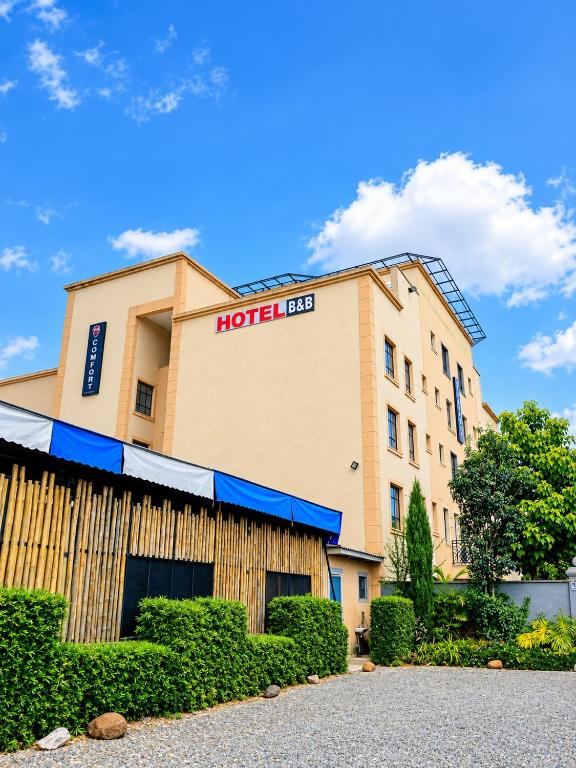 a hotel sign on the side of a building at COMFORT E SUITES in Nairobi