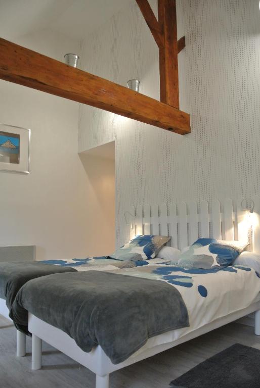 Postel nebo postele na pokoji v ubytování La Fresnée chambres d'hôtes