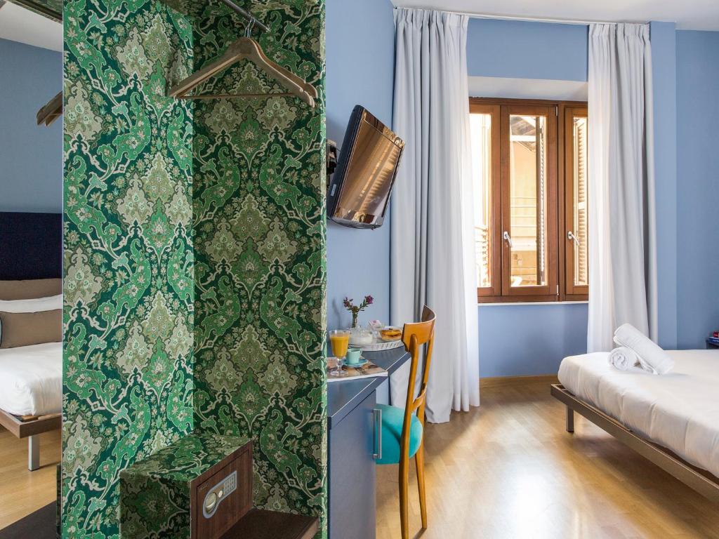Cama o camas de una habitación en Monti First
