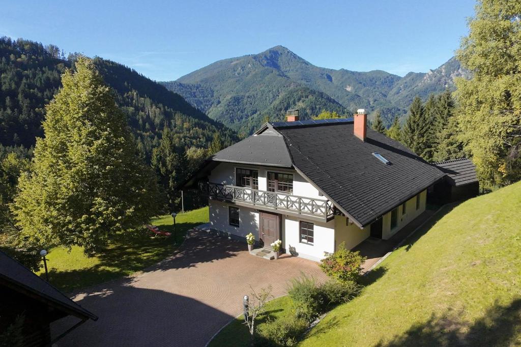 an aerial view of a house in the mountains at Karami Mountainhouse in Tržič