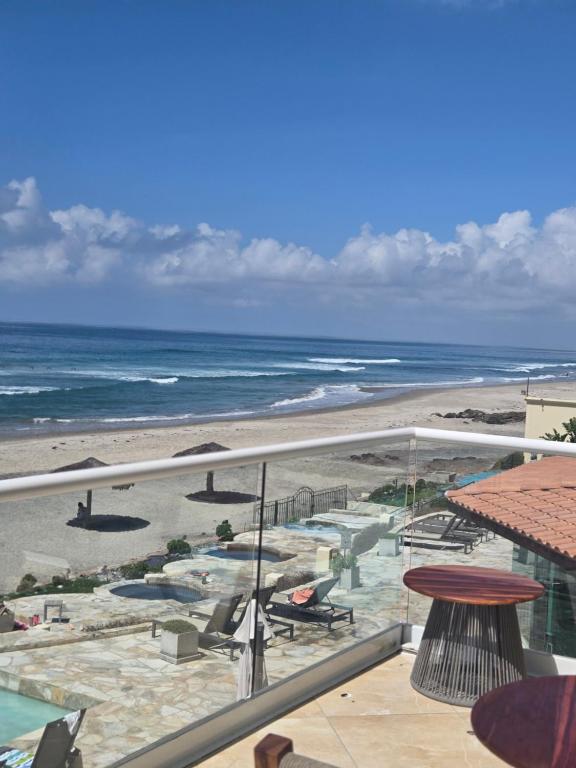 a view of the beach from the balcony of a resort at Sol y mar in Rosarito Beach
