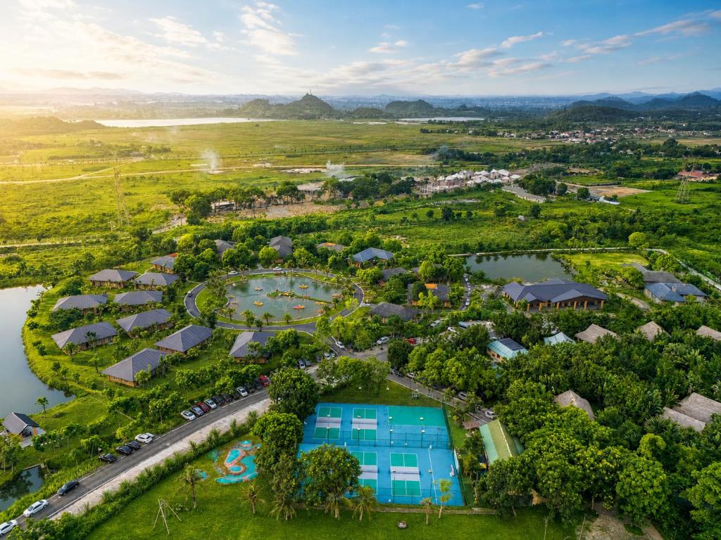 an aerial view of a resort with a pool at Cuc Phuong Mineral Retreat in Ninh Binh