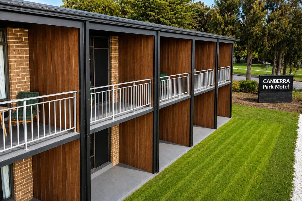 a building with balconies on the side of it at Canberra Park Motel in Canberra