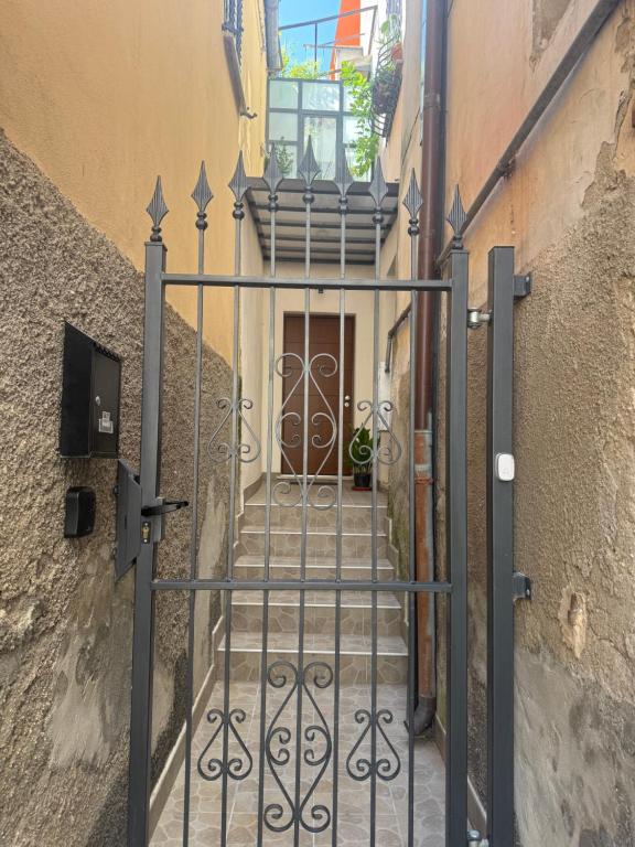 a stairway with a gate leading into a building at Appartamento vacanza Penne in Penne