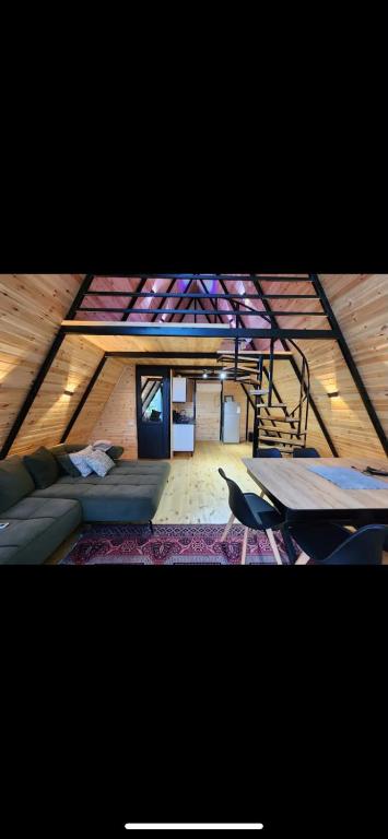 a room with a couch and a table in a room at Villa cottage D3 in Zeda Ulianovka