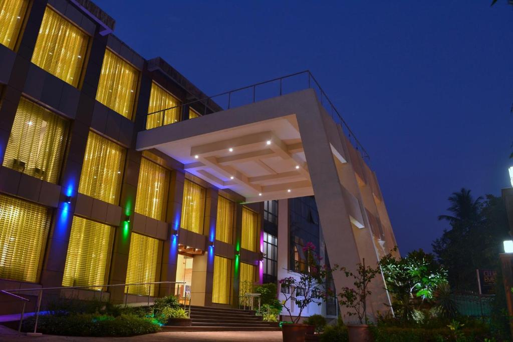 a building with lights on it at night at Club Emerald in Mumbai