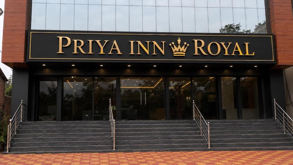 a building with a sign that reads priya in im royal at priya inn royal in Lakhīmpur