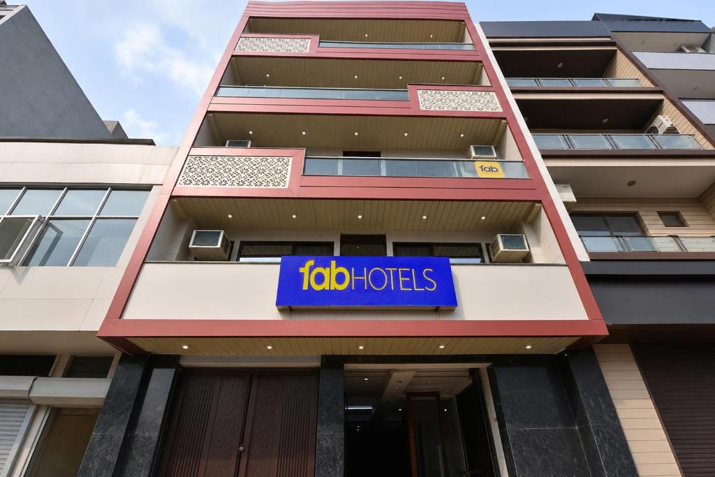 a building with a sign on the side of it at FabHotel Snereya in New Delhi