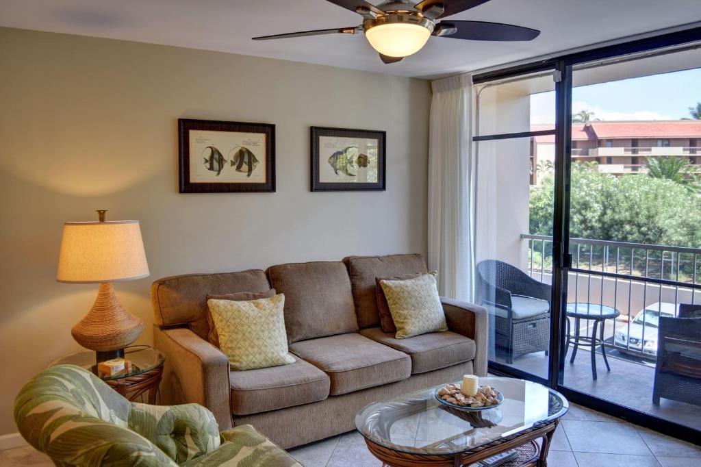 a living room with a couch and a table at Pacific Shores B303 in Kihei