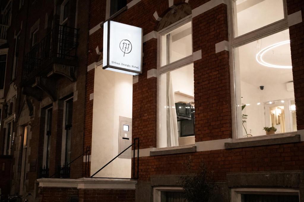 a sign on the side of a brick building at Hotel 171 in Rotterdam