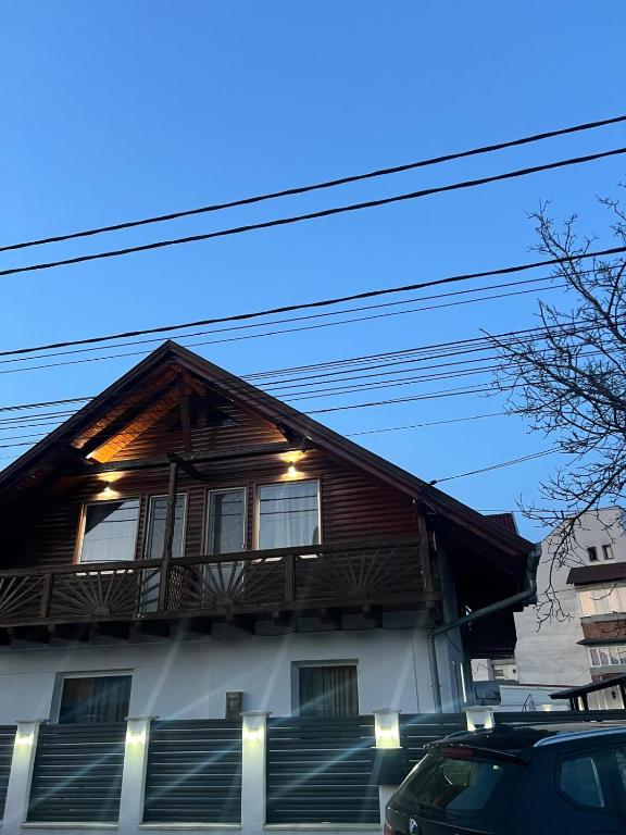 a house with a balcony on the side of it at Casa Roland in Sovata