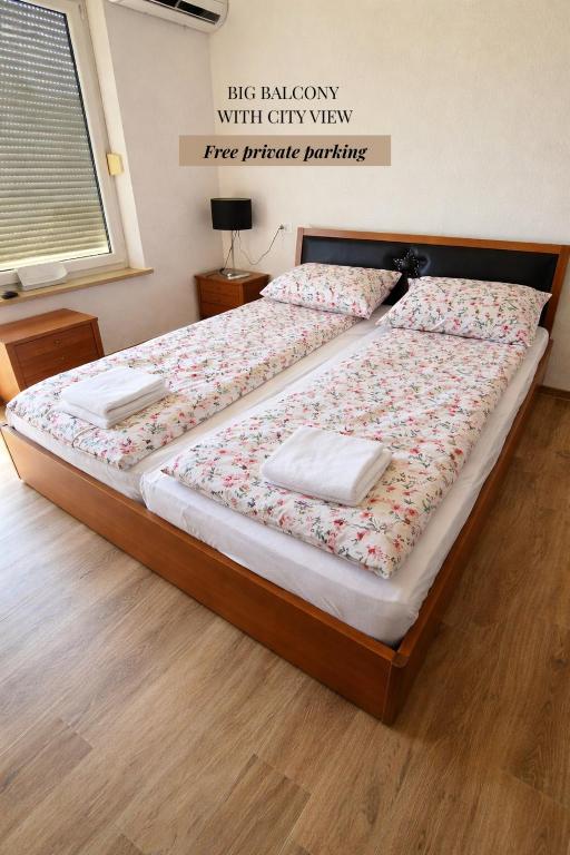 a bed with two pillows on it in a bedroom at Halalko Konak in Šmarje-Sap