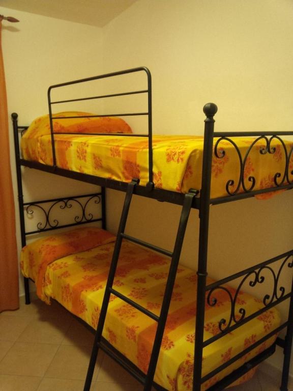 A bed or beds in a room at Dimora San Pietro