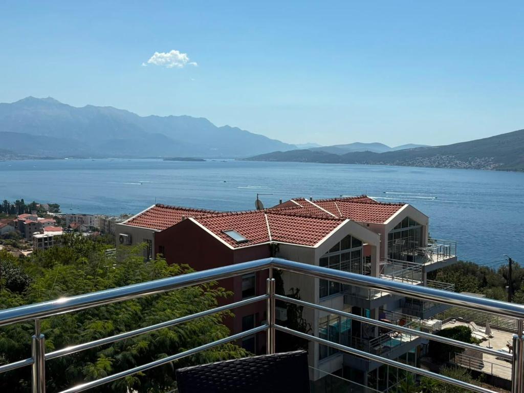 a view of the water from a balcony of a building at Acacia Hills D8 in Herceg Novi in Herceg-Novi