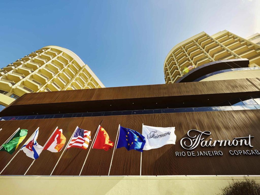 a group of flags on the side of a building at Fairmont Rio de Janeiro Copacabana in Rio de Janeiro