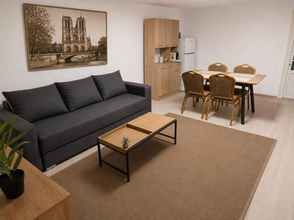 a living room with a couch and a table at Danube Exclusiv in Calafat