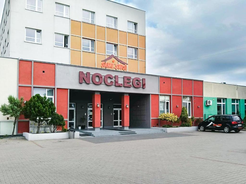 a building with a nocet sign in front of it at Sami Swoi Kutno in Kutno