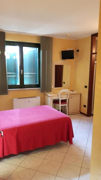 Postel nebo postele na pokoji v ubytování Hotel Armida