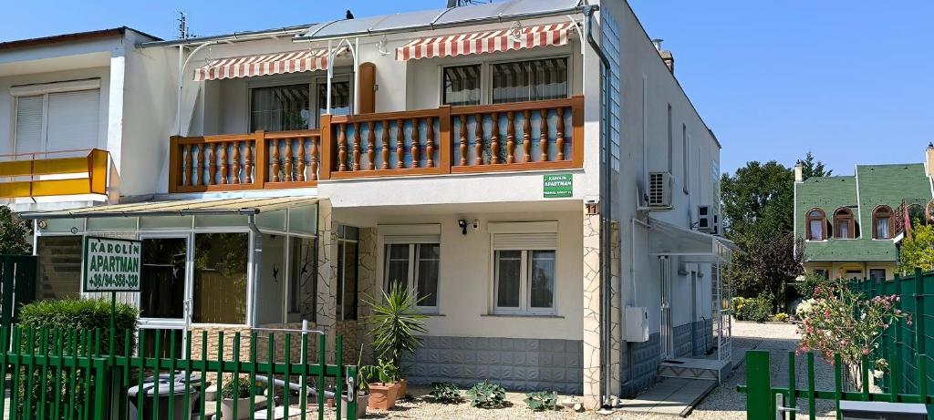 a house with a balcony on top of it at Karolin Apartman in Bükfürdő