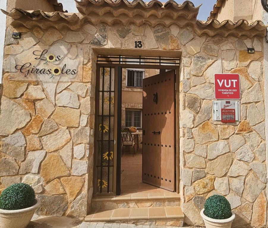 an entrance to a building with a exit sign on it at Casa Turística Los Girasoles 