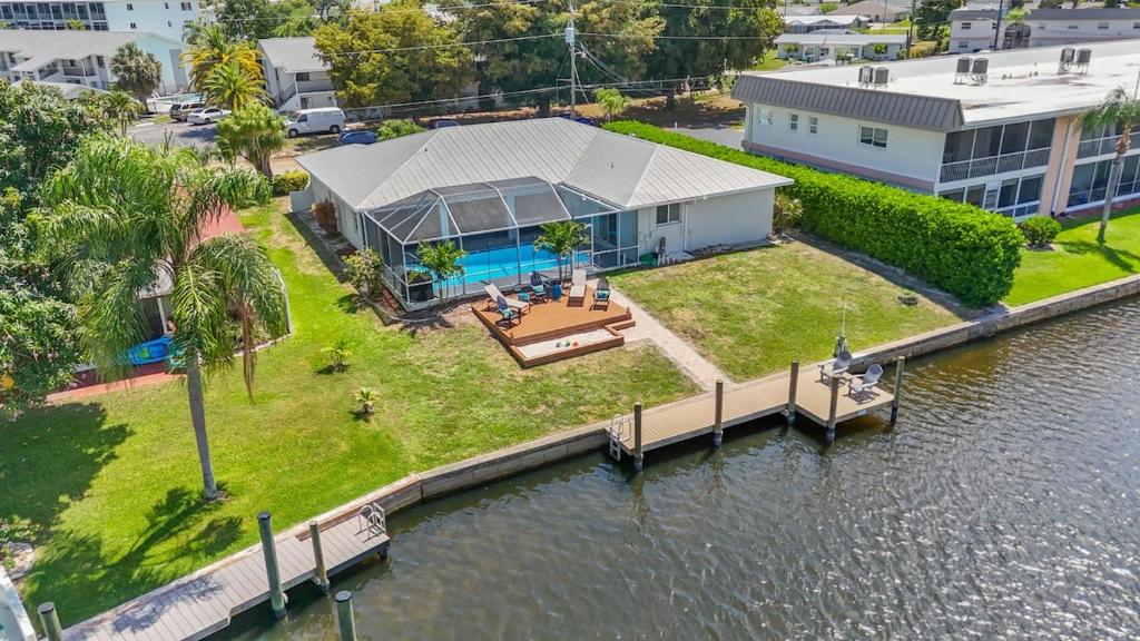 an aerial view of a house next to the water at Waterfront Pool Game Room Gulf Access in Cape Coral