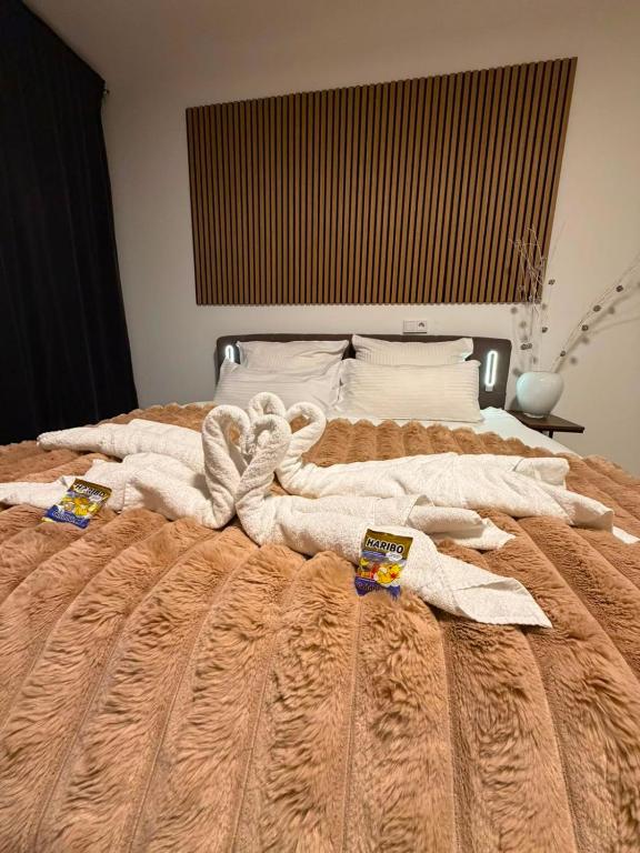 a bedroom with a bed with towels on it at Eibisch Apartments in Passau