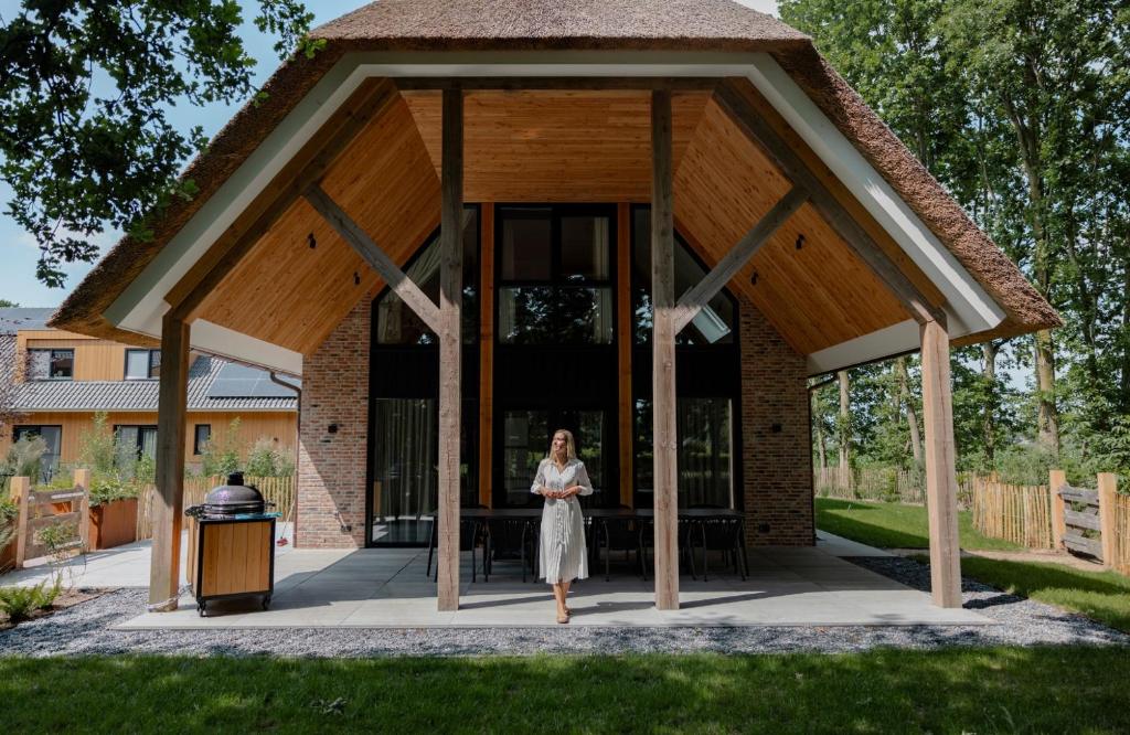 a woman standing in front of a gazebo at Resort Valley in Wekerom