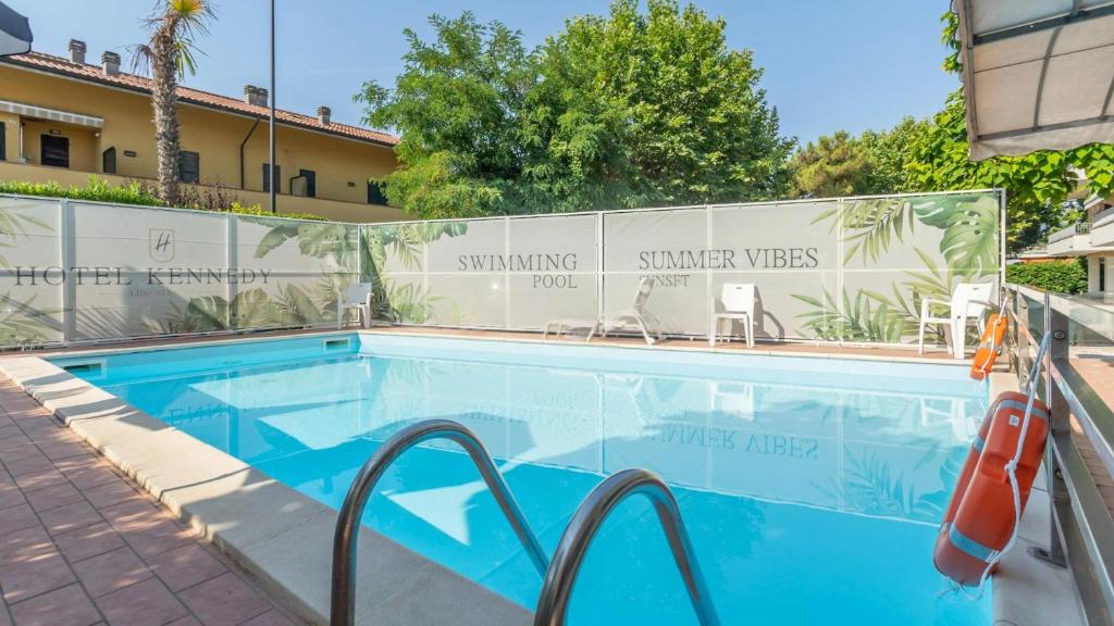 a swimming pool at a hotel with a resort at Hotel Kennedy in Lido di Savio