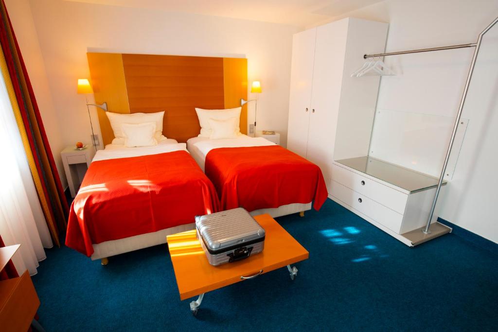 Postel nebo postele na pokoji v ubytování Design Hotel Zollamt