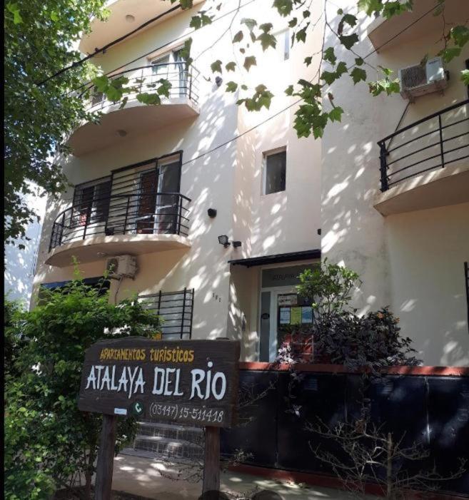 a building with a sign in front of it at Ayalata del Rio in Colón