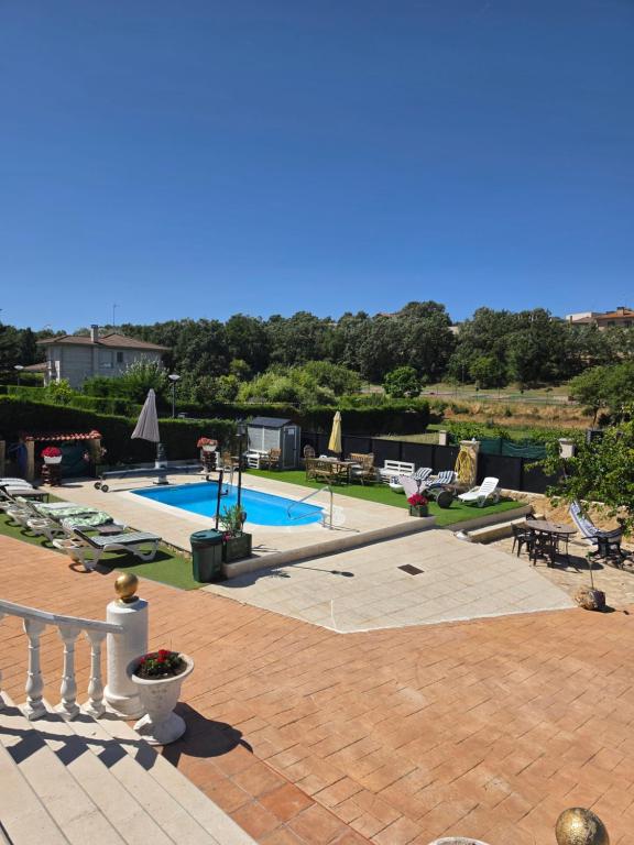 a view of a swimming pool from a house at Castillo Valmoral in Burgos