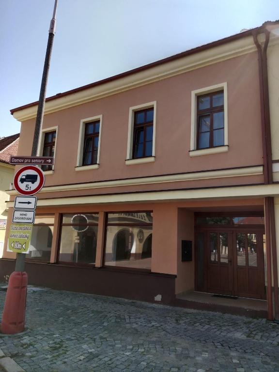 a building with a no parking sign in front of it at Apartmán Netolice in Netolice