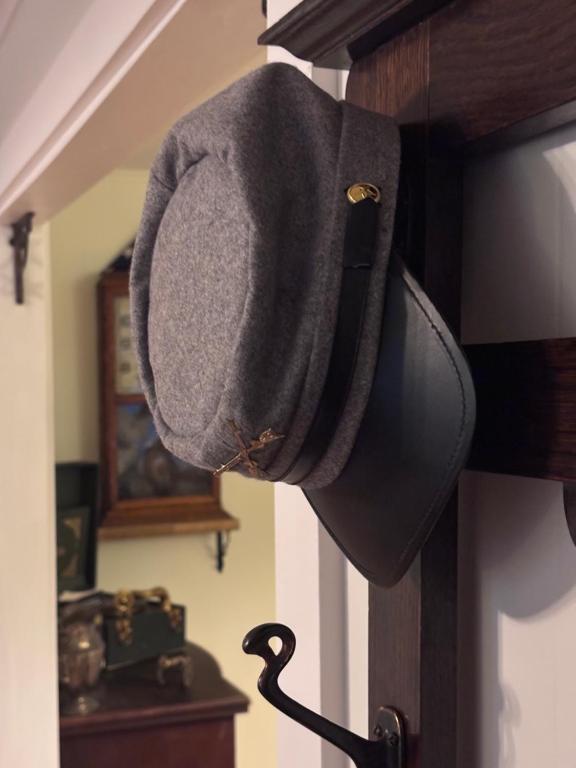 a hat hanging on a wall in a room at Cannon House Retreat in Fayetteville