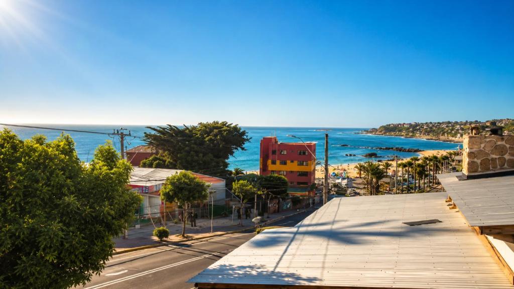 an aerial view of a city with the ocean at Hostal Boutique F in El Quisco