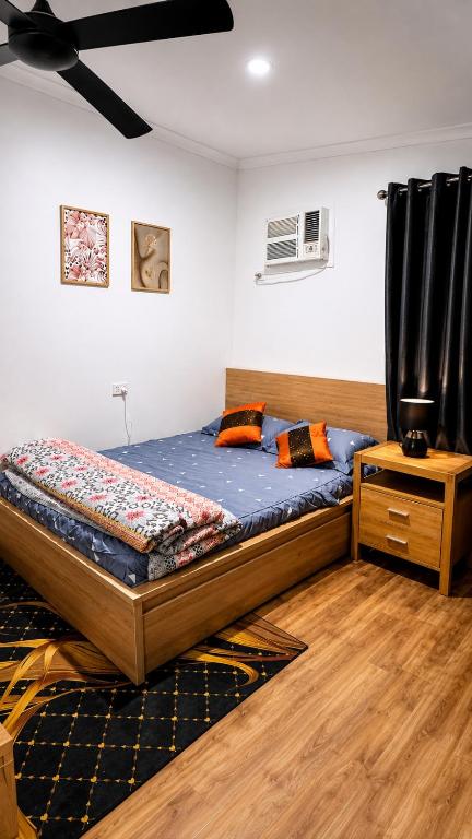 a bedroom with a bed and a night stand at Private Guest Studio House, Separate Entry in Brisbane