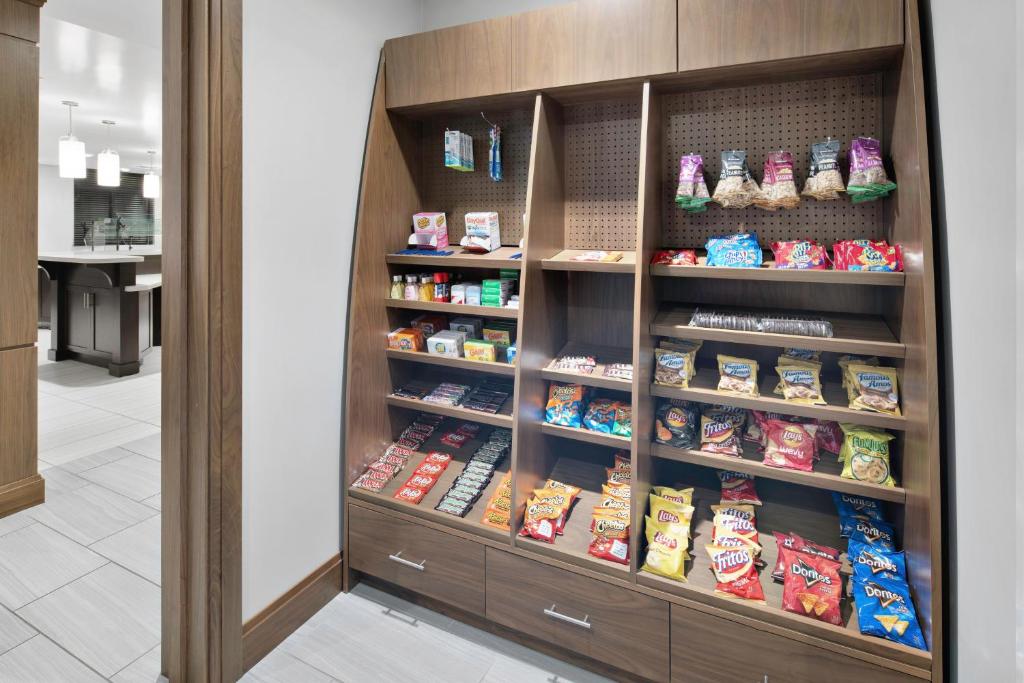 a display cabinet with food in a store at Staybridge Suites Irvine - John Wayne Airport by IHG in Irvine