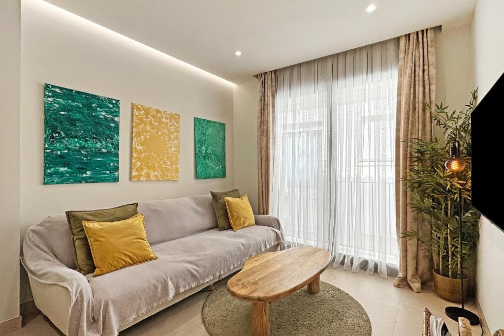a living room with a couch and a table at Antika Marbella 1A in Marbella