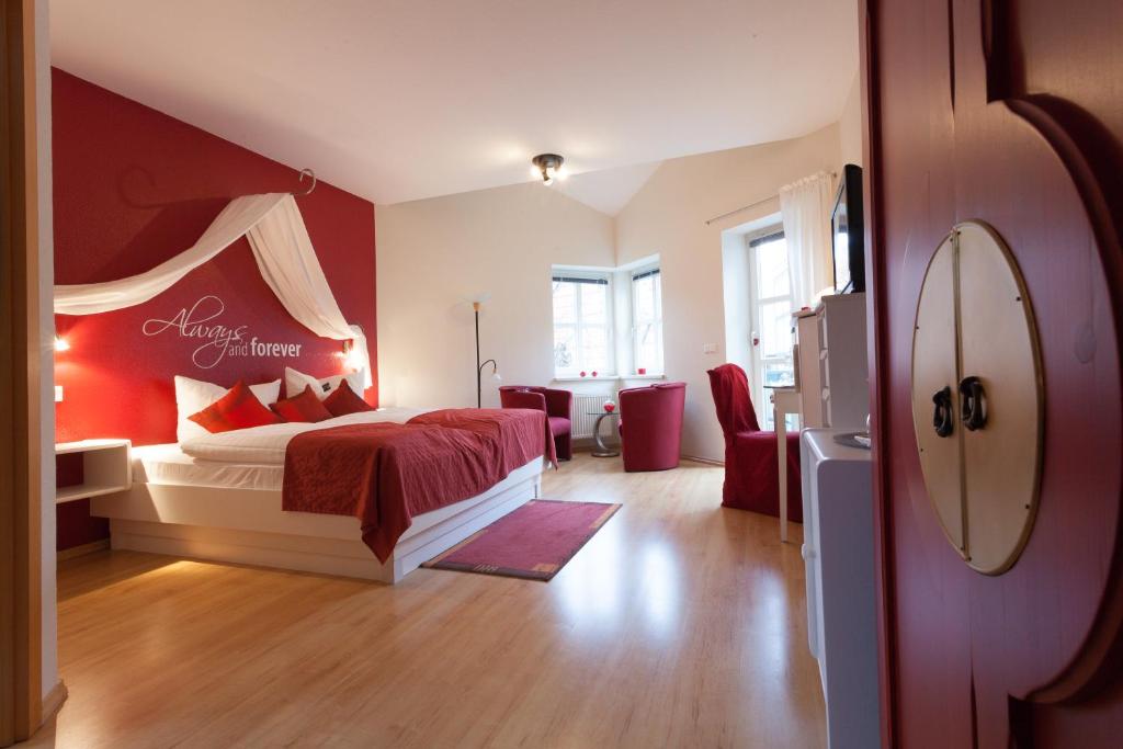 Postel nebo postele na pokoji v ubytování Hotel Am Grudenberg