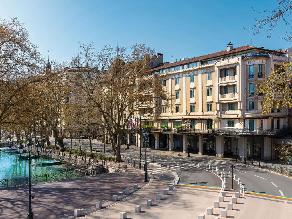 a street in front of a building with a road at Le Splendid Hotel Lac D'Annecy - Handwritten Collection in Annecy