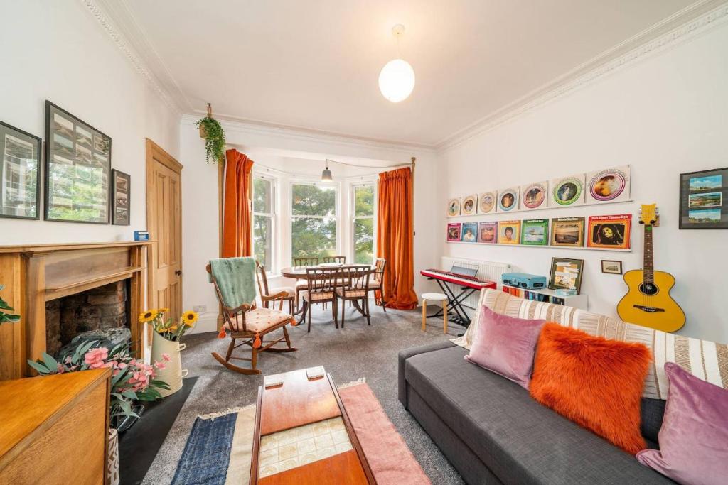 a living room with a couch and a fireplace at The Palais in Dundee