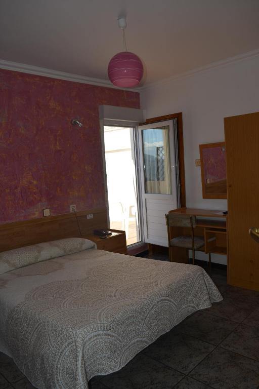 Postel nebo postele na pokoji v ubytování Hostal Manolete