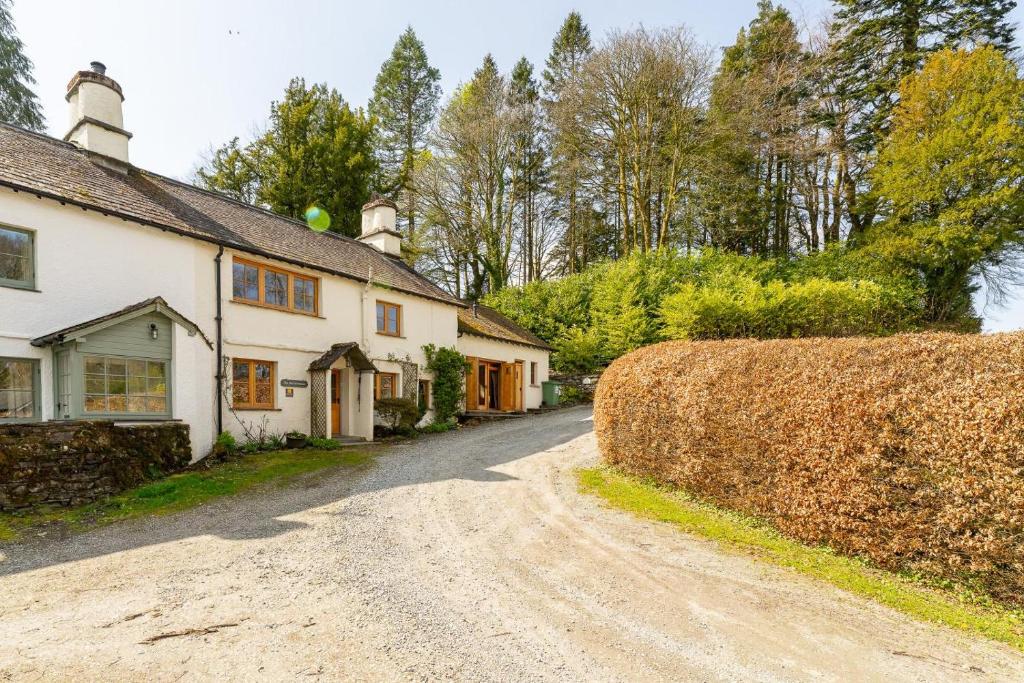 a dirt road in front of a house at 4 Bed in Hawkshead oc-lr116 in Hawkshead
