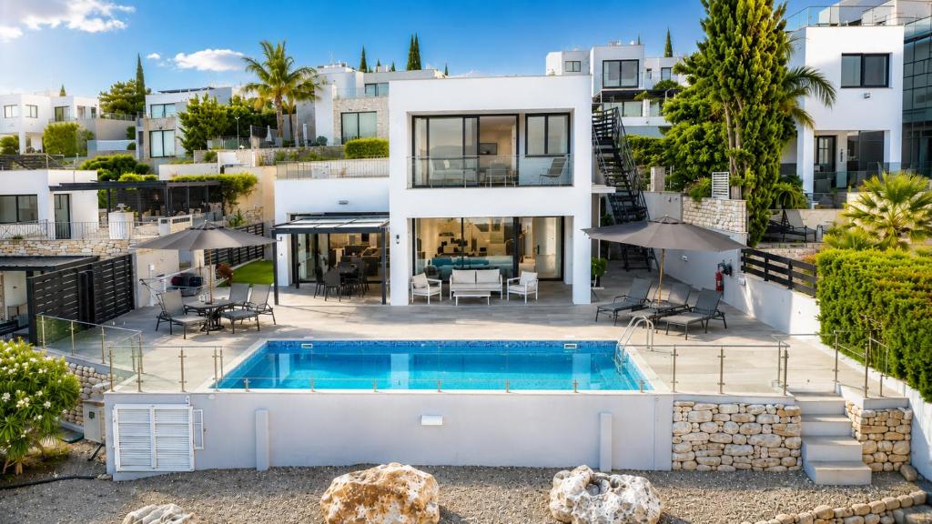 an aerial view of a house with a swimming pool at Blue Infinity Villa 33 in Neo Chorio