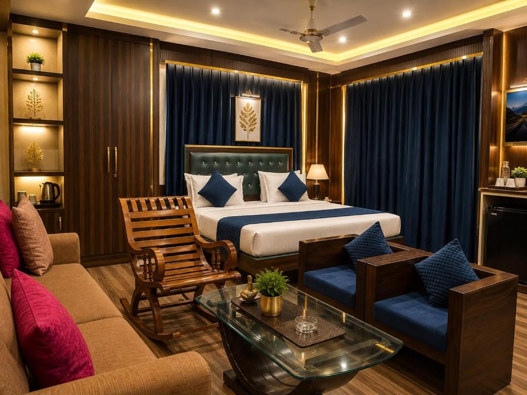 a hotel room with a bed and a couch at Castal Blue Hotel Near IGI Delhi Airport - Free Breakfast and Dinner complementry in New Delhi