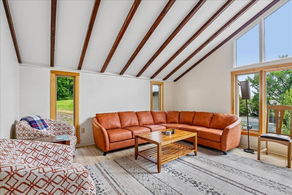 a living room with a couch and a table at The Mercer House in Stowe