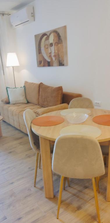 a living room with two tables and a couch at Victor spa Apartment in Veliko Gradište