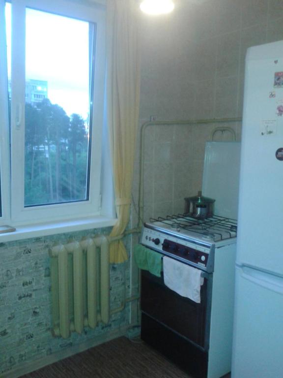 A cozinha ou cozinha compacta de Apartment on Volgogradskaya