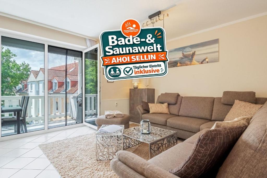 a living room with a couch and a table at Strandurlaub Baabe - Bade- & Saunawelt täglich inklusive in Baabe